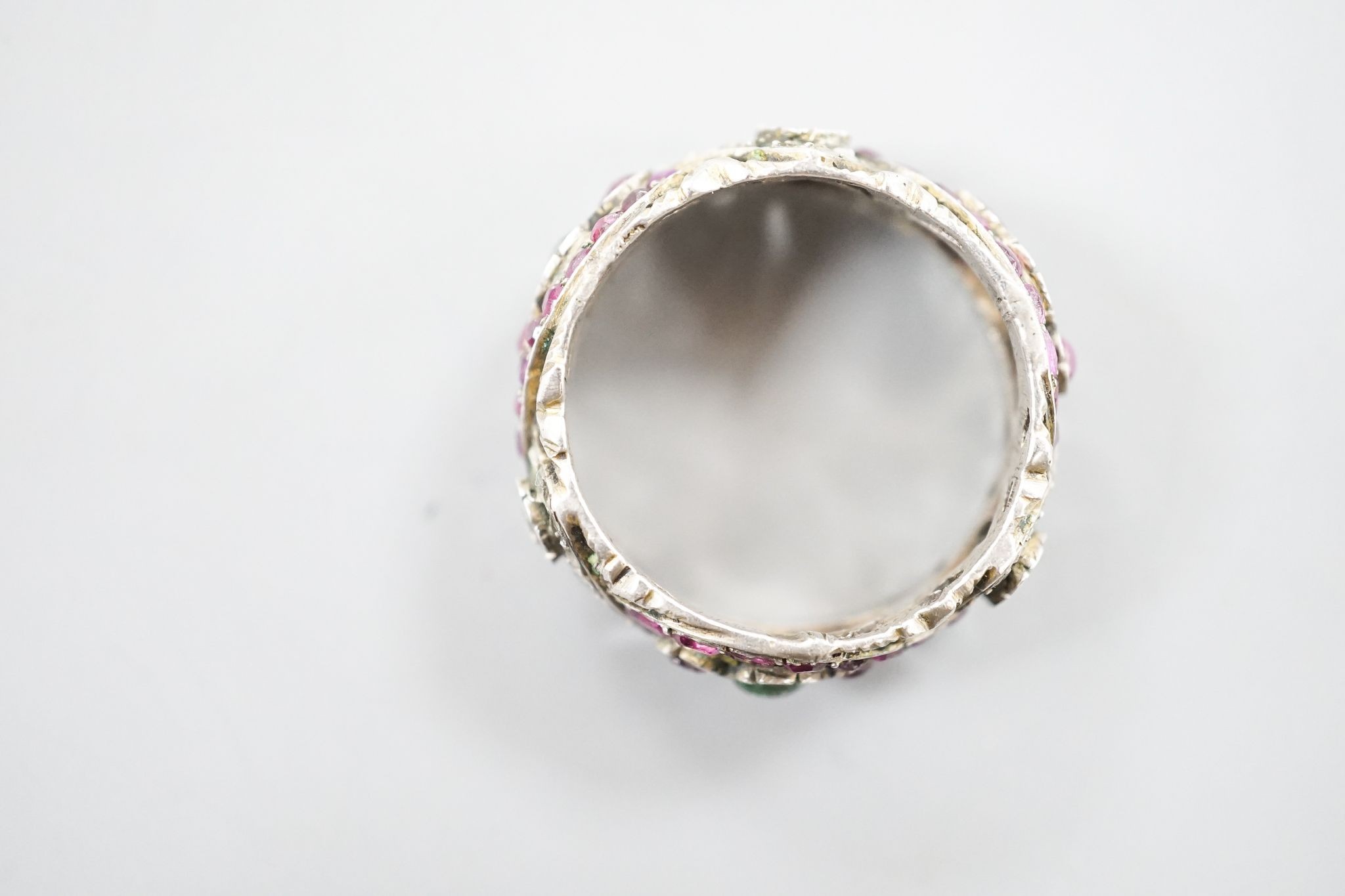 A 19th century Austro-Hungarian pierced white metal, diamond and gem set band, size W/X.